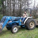 Picture of Tim and Charlie on the tractor together