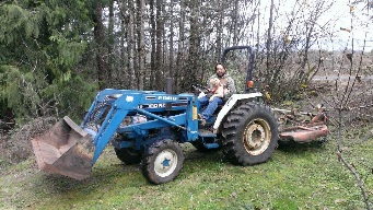 Picture of Tim and Charlie on the tractor together